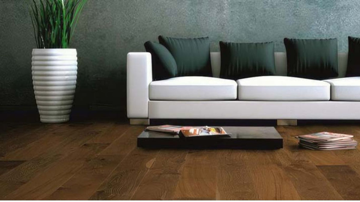 Osmo Polyx Oil image with dark floor and white sofa