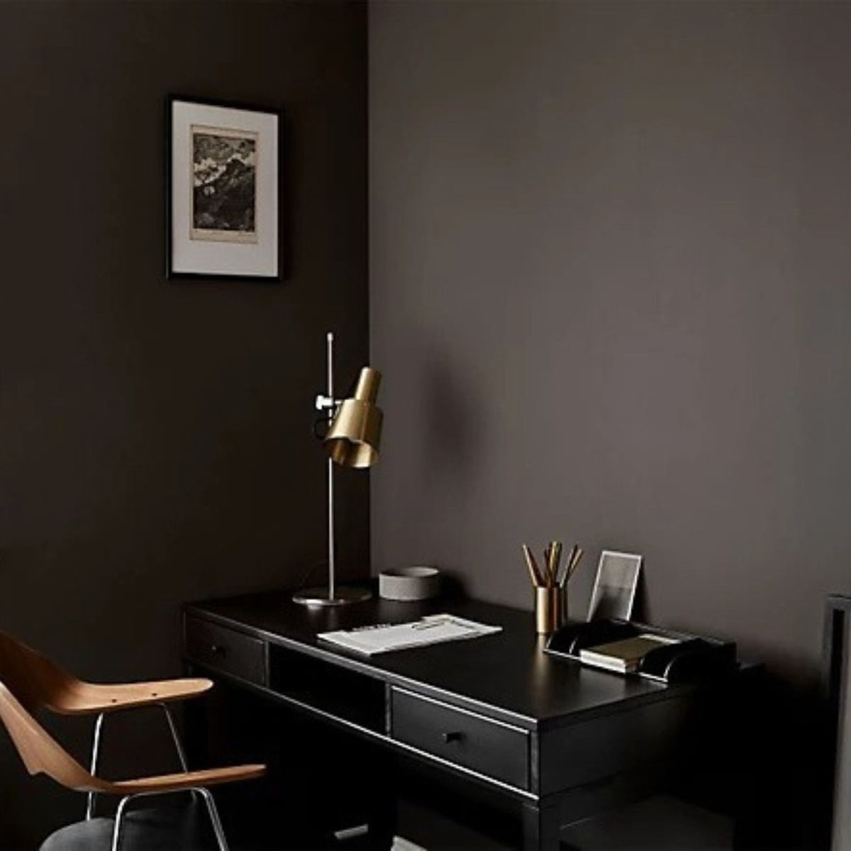 Interior domestic office painted in Mylands Raw Umber with dark desk and wooden chair in front
